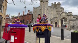 Coronation for King Charles III: Postbox toppers on postboxes by Windsor Castle of the crown and the Royal family