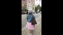 Funny video of man looking at influencer at she films content by The Long Walk, Windsor castle for King Charles III Coronation