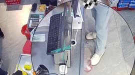 Woman tries to steal meat by kicking it under her feet in Chinese supermarket