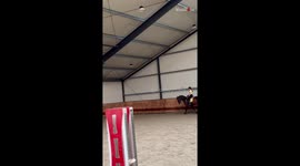Rider falls alongside horse when trying to jump over a fence *Epic Fail*