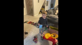 Toddler outsmarts parents and child safety gate, and celebrates with a dance