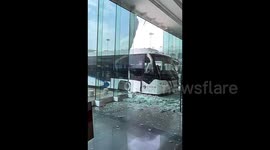 Shuttle bus collides with glass wall at China’s airport, no injuries reported