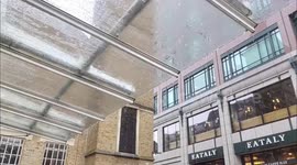 Pouring down with rain at Liverpool Street Station, London, UK