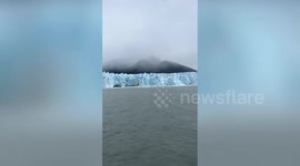 Ice breaks off massive light blue glacier in Argentina