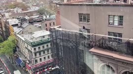 Daredevil New York City construction workers strolls high above city