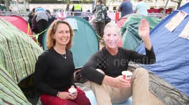 A King Charles Lookalike is seen among the people camping out in The Mall