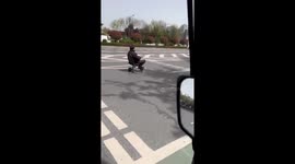 Elderly Chinese man spotted driving modified wheelchair on road