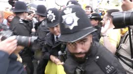 Scuffles as police confiscate anti-monarchy banner from protesters on Coronation morning in London