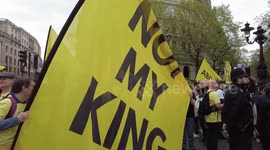 Royal fans and anti-monarchists yelling 'Not mu King' in Trafalgar square, London, UK