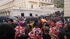 Rain hits those people waiting on The Mall on the day of the Coronation