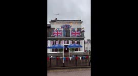 Pub in Windsor celebrates the coronation with cardboard cut out of King Charles and Queen Camilla and Union Jack bunting
