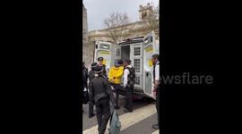 Moment anti-monarchy protester in handcuffs is led into police van before coronation