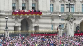 Crowds wave union jacks as royals appear on Buckingham Palace balcony
