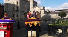 Cute knitted Royal Family on top of the post boxes outside of Windsor Castle