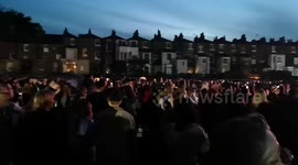 The audiance watching the Royal Coronation Concert down the Long Walk sing God Save The King