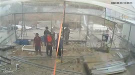 Builders flee as wind and rain batter marquee during storm in Thailand