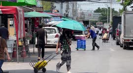 Tourists visit sprawling weekend market as tourism rises again in Bangkok, Thailand