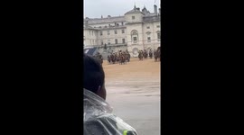 Soldiers and horses marching and carrying chariots at st james park after the coronation procession