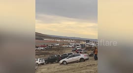 Racers drift around oval track at stock car racing event in Argentina