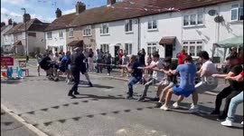 Hilarious moment rope snaps during game of tug of war in celebration of the king's coronation