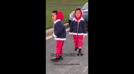 Dad explaining to his black twin sons that black is beautiful.