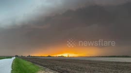 US: Other-Worldly Scene As Setting Sun Peeks Through Massive Shelf Cloud In Illinois