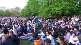Royal fans warch live broadcast of Coronation Consert at Windsor Castle in St James Park in London
