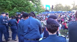 Royal fans watch live broadcast of Coronation Concert at Windsor Castle in St James's Park - London