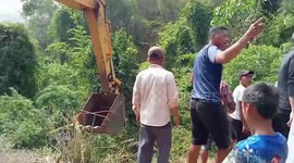 Dozens of villagers pull pick-up truck that fell from hillside cliff