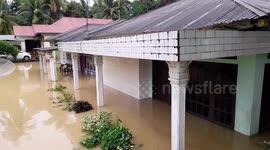 Heavy rains caused rivers to overflow and floods submerged settlements in Indonesia