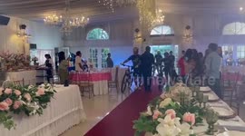 Cyclist couple marries with unique entourage wearing biking suits