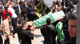 Mourners in Gaza carry bodies of those killed during Israeli strikes through streets