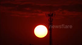 The Red Sun And A 5G Base Station in Yichang, China