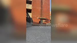 Skateboarder slams while trying 360 flip down set of stairs