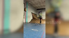 Skateboarder slams while trying backside noseblunt slide trick