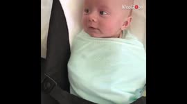 'Cutest thing ever!' - Swaddled-up newborn baby boy tries 'so hard' to talk to his mom
