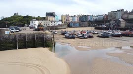 Views of Tenby Harbour and life boat stations at low tide at low