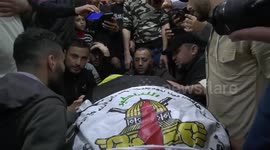Mourners attend the funeral of Palestinian Islamic Jihad group member Jihad Ghannam and his wife in Rafah in the southern Gaza Strip, following their death in a pre-dawn Israeli air strike