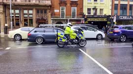 A Diplomats Convoy Seen Returning To Kensington Palace Gardens After The Coronation Of King Charles III