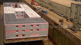 Three-storey barge set to house 500 migrants undergoes refit at Cornish port