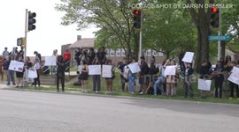 Students from Shawnee Mission North High School publicly protest against teacher Caedran Sullivan who is speaking out against divisive
