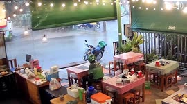 Electric transformer explodes due to storm as customer collects noodles in restaurant