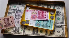 Chinese Yuan And U.S. Dollar Demonstration As RMB Continues to Depreciate Against USD in Yichang, China