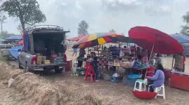 Food cart umbrellas and tents blown away by powerful winds during Thai festival