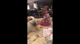 Baby can't stop giggling while playing with her best friend fur-ever