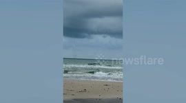 Bizarre UFO-like funnel cloud forms after waterspout is spotted off Thai coast