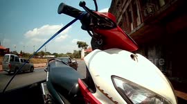 Monkey thief climbs onto motorcycle and steals the keys
