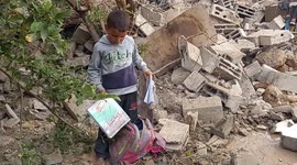 Palestinian families inspect damages of Israeli airstrikes