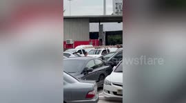 Crazed woman 'troubled by business problems' shatters car windscreen using hammer