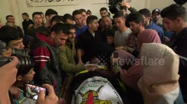 Mourners attend the funeral of Palestinian Abdel Halim al-Najjar, 22, who was killed in an Israeli strike, in Jabalia, in the northern Gaza Strip